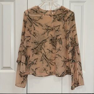 See through rose colored floral blouse